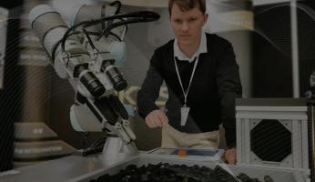 A man building a robotic arm