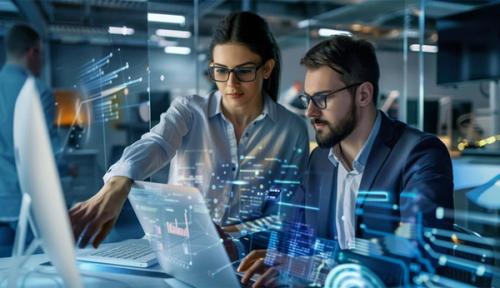 Immagine stock che mostra due colleghi in un ambiente tecnologico.