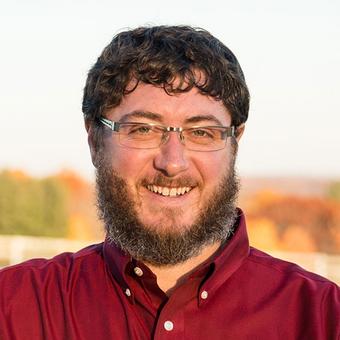 headshot of Glendon Kuhns