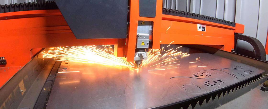 a laser cutter slicing through metal