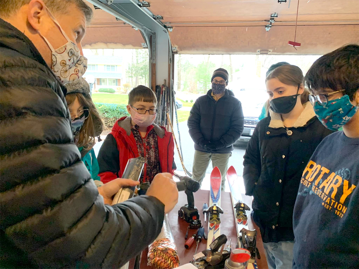 Zemsky and students building a sled.