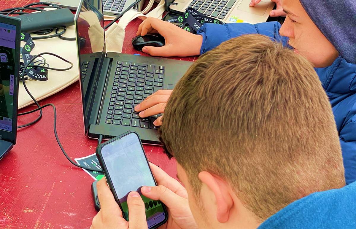 Student using a smartphone to model in Onshape.