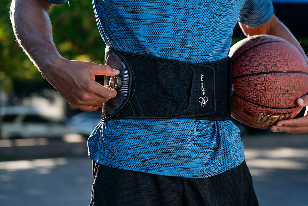 basketball player wearing a back brace with BOA technology