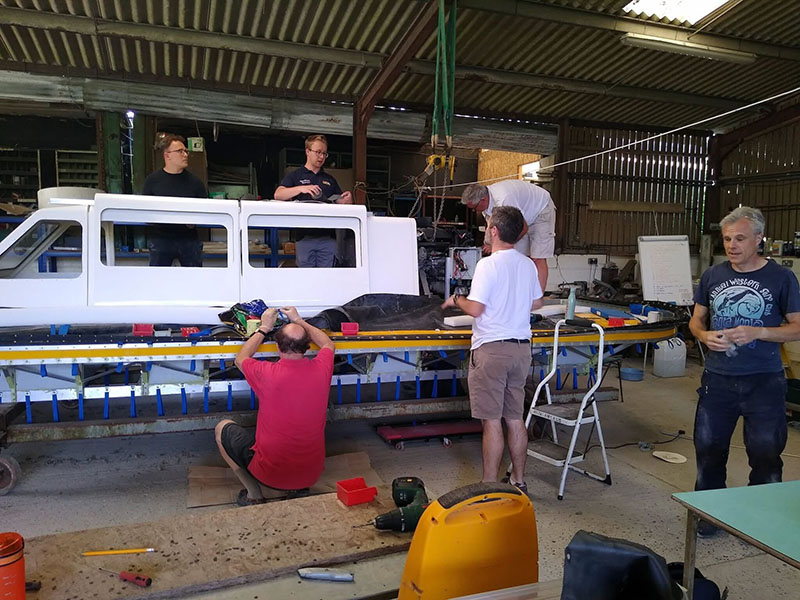 HoverAid team assembling their design in a large barn on a farm in Sussex, UK